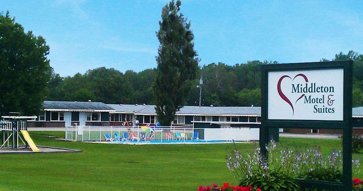 Middleton Motel & Suites landscaped property, outdoor pool, and guest rooms